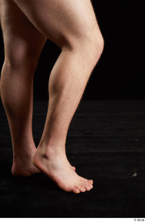 Torin  1 calf flexing nude side view 0005.jpg